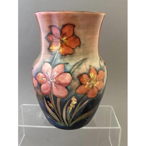 593 - Ceramics: Ceramics: A Moorcroft Pottery flambe vase painted with the Freesia pattern, stamped and si... 