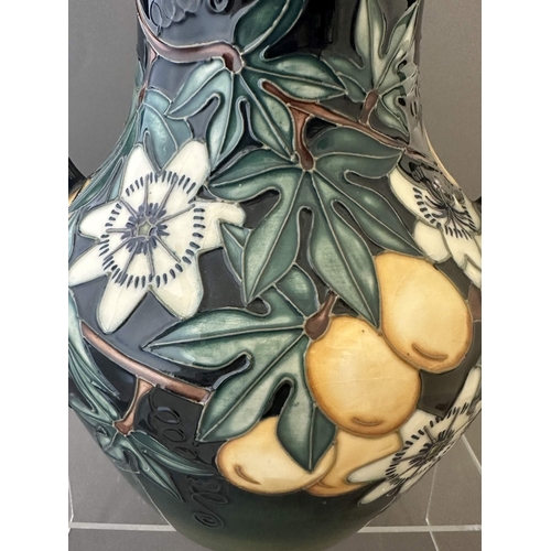 594 - Ceramics: Ceramics: A Moorcroft Pottery two handled amphora style vase, decorated with the 