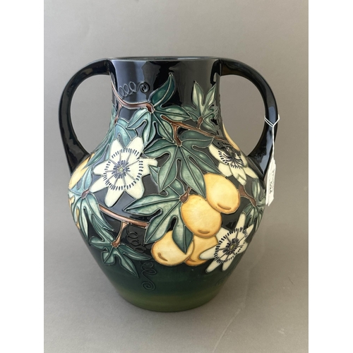 594 - Ceramics: Ceramics: A Moorcroft Pottery two handled amphora style vase, decorated with the 