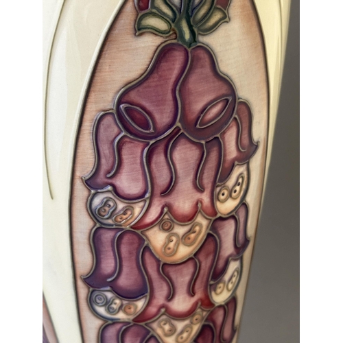 599 - Ceramics: Ceramics: A Moorcroft Pottery vase, decorated in the Foxglove pattern, designed by Rachel ... 