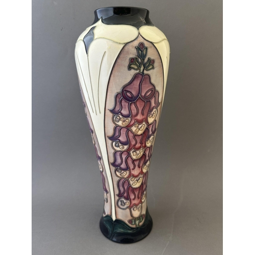 599 - Ceramics: Ceramics: A Moorcroft Pottery vase, decorated in the Foxglove pattern, designed by Rachel ... 