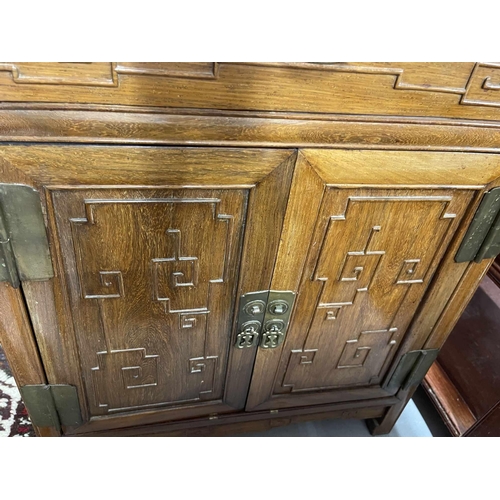 65 - Chinese: Chinese: Hardwood cabinet with panel top on scroll ends. 76cm x 82cm.