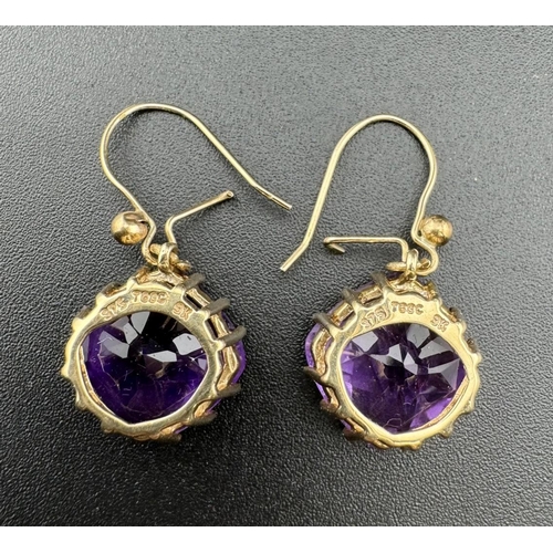 684 - Jewellery: Jewellery: Boxed 9ct gold mounted facet cut amethyst earrings, each cushion cut stone app... 