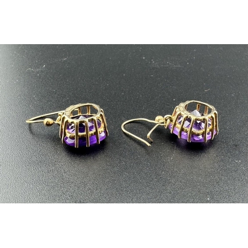 684 - Jewellery: Jewellery: Boxed 9ct gold mounted facet cut amethyst earrings, each cushion cut stone app... 