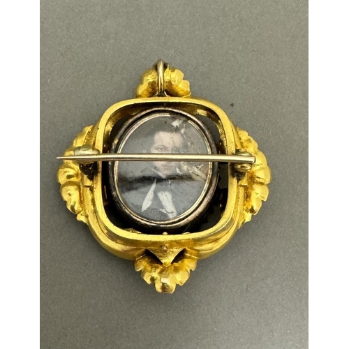 700 - Jewellery: Jewellery: A yellow metal mourning brooch, the front set a miniature portrait on ivory of... 