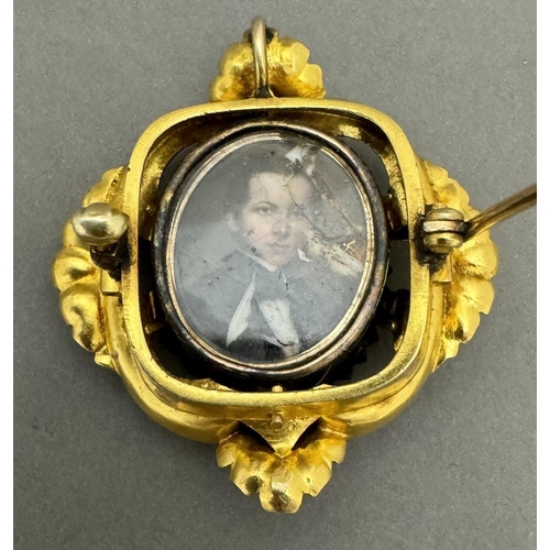 700 - Jewellery: Jewellery: A yellow metal mourning brooch, the front set a miniature portrait on ivory of... 