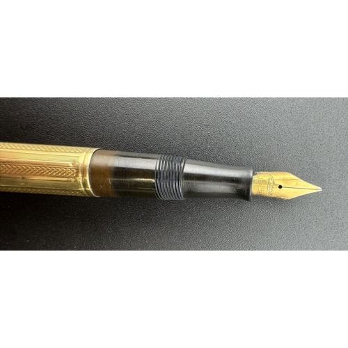 709 - Pens: Pens: An early 20th century Watermans lever fill fountain pen, a bakelite body with French 18c... 