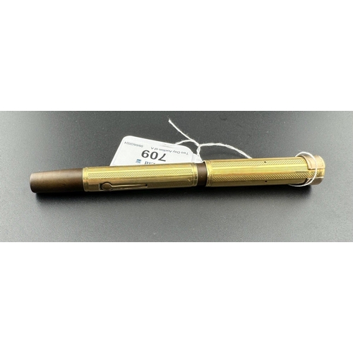 709 - Pens: Pens: An early 20th century Watermans lever fill fountain pen, a bakelite body with French 18c... 