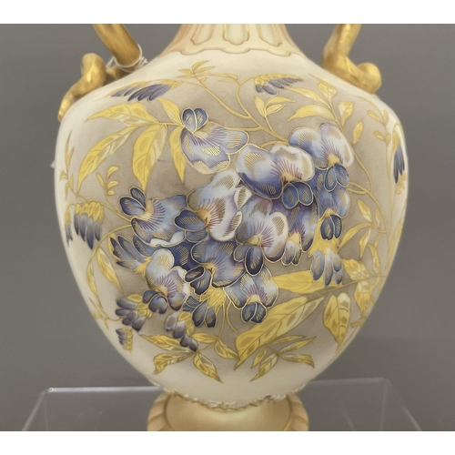 713 - Ceramics: Ceramics: A Royal Worcester blush ivory dahlia decorated vase, with gilded cobra handles, ... 