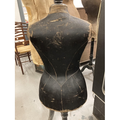 101 - Textiles - Tailors Dummy: A small French child mannequin carved in black silk on an ebonised tripod ... 