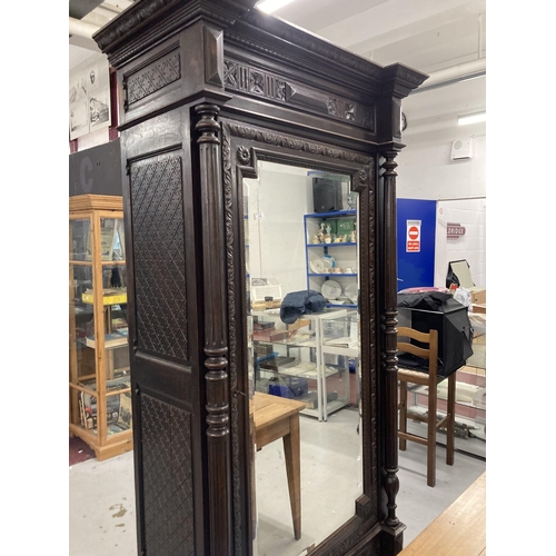 118 - Furniture: French 19th century stained oak armoire, stepped moulded construction with single inset b... 