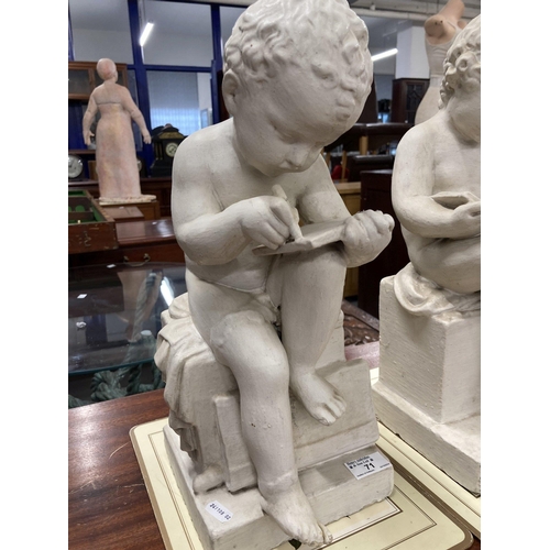 71 - Ceramics: A pair of painted plaster cherubs, one depicted reading, the other writing. 43cm and 41cm ... 