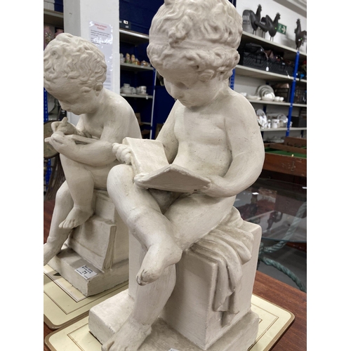 71 - Ceramics: A pair of painted plaster cherubs, one depicted reading, the other writing. 43cm and 41cm ... 