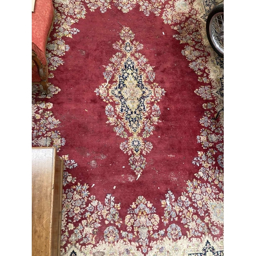 85 - Rugs & Carpets: Early 20th cent. British carpet, red ground with central floral motif and one la... 