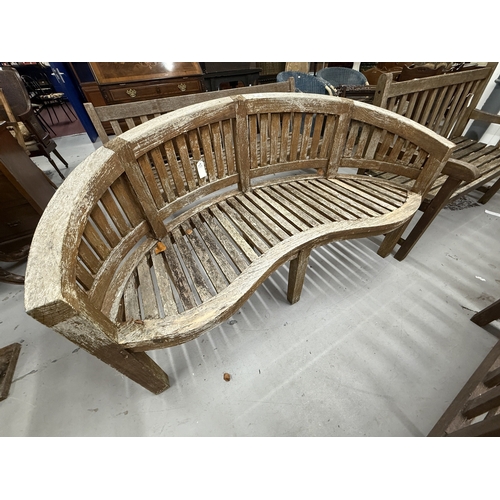 103 - Gardenalia: Gardenalia: Three seater teak crescent shaped bench. 154cm x 87cm x 65cm.