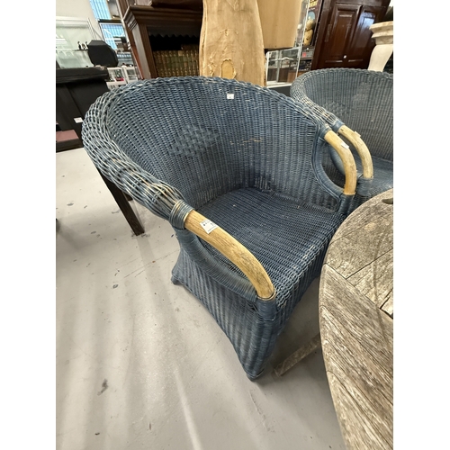 113 - Gardenalia: Gardenalia: Two Lloyd Loom style armchairs in blue with exposed beech handholds, the rat... 