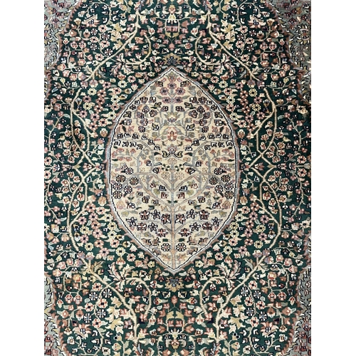 118 - Carpets & Rugs: Carpets & Rugs: 20th century silk Persian/Indian Sarouk green ground, ivory cent... 