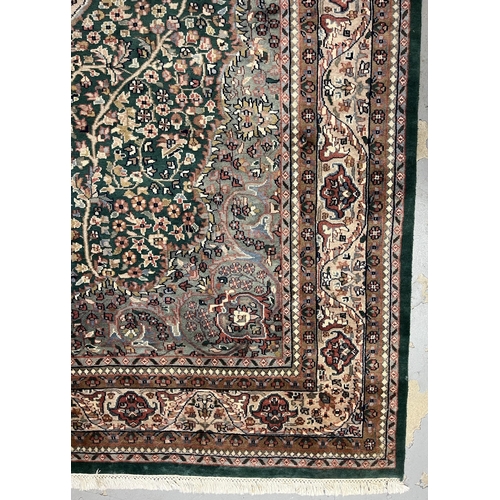 118 - Carpets & Rugs: Carpets & Rugs: 20th century silk Persian/Indian Sarouk green ground, ivory cent... 