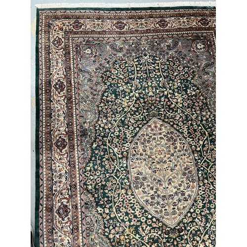 118 - Carpets & Rugs: Carpets & Rugs: 20th century silk Persian/Indian Sarouk green ground, ivory cent... 