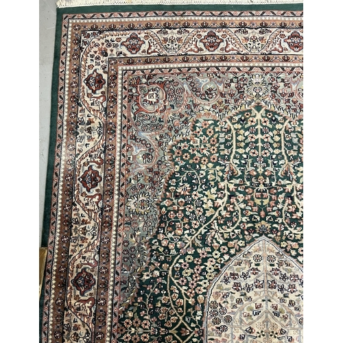 118 - Carpets & Rugs: Carpets & Rugs: 20th century silk Persian/Indian Sarouk green ground, ivory cent... 