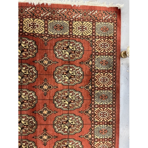 119 - Carpets & Rugs: Carpets & Rugs: Two 20th century Bakhara rugs the first with red ground, central... 