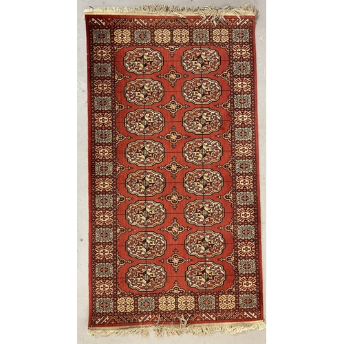 119 - Carpets & Rugs: Carpets & Rugs: Two 20th century Bakhara rugs the first with red ground, central... 