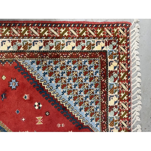 121 - Carpets & Rugs: Carpets & Rugs: 20th century Caucasian modern Kazak rug red ground, central diam... 