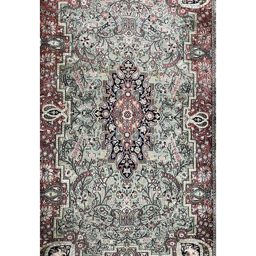 122 - Carpets & Rugs: Carpets & Rugs: North India silk carpet, green ground, central panel with floral... 