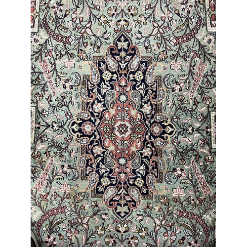 122 - Carpets & Rugs: Carpets & Rugs: North India silk carpet, green ground, central panel with floral... 