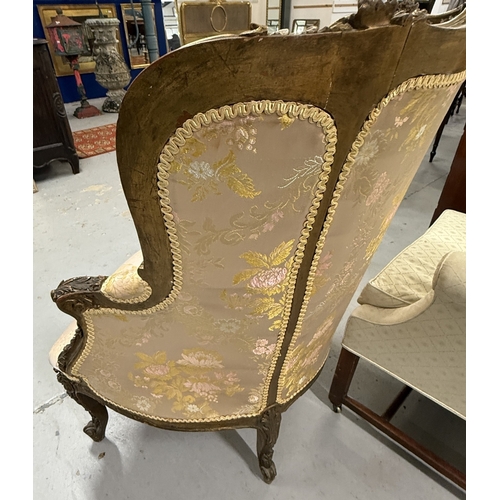 156 - Furniture: Furniture: 18th century giltwood upholstered wingback chair elaborately carved, upholster... 