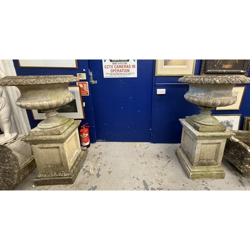 188 - Gardenalia: Gardenalia: 20th century pair of Neo-Classical style urns on pedestal stands. 140cm x 80... 