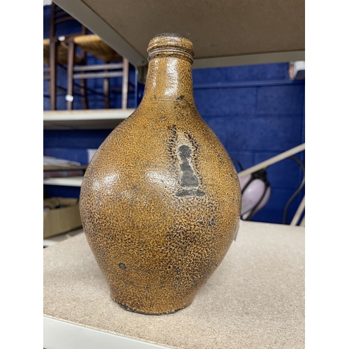 22 - Ceramics: Ceramics: A 17th/ 18th century bellarmine type jug, with tiger ware style salt glaze. Miss... 