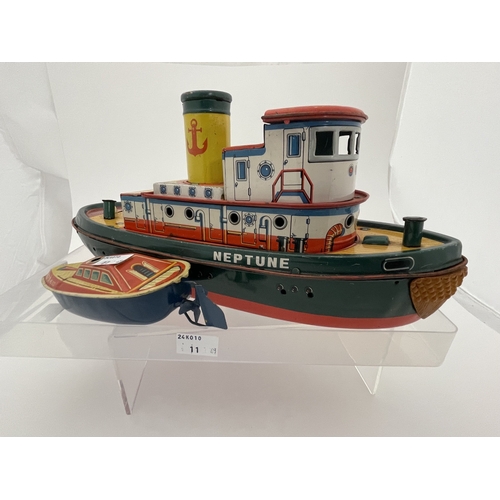 399 - Toys and Games Toys and Games: Barco, Japan, Tinplate battery powered wheeled tugboat, a meltoy temp... 