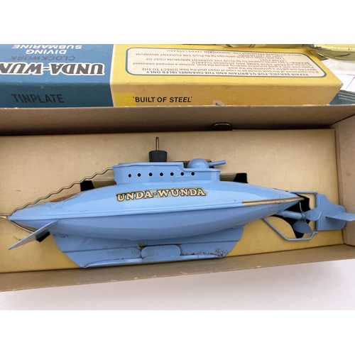 401 - Toys and Games Toys and Games: Sutcliffe template unda-wunda, clockwork, driving submarine, boxed, p... 