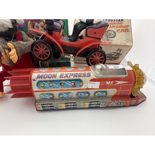 402 - Toys Toys: Jolly Chimp performing monkey (Taiwan) plus shaking antique car (Japan) Both battery oper... 