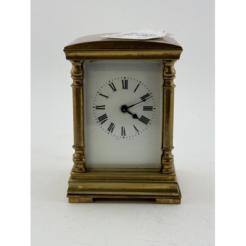 502 - Clocks: Clocks: A miniature French four glass carriage timepiece, with domed top, enamel dial and in... 