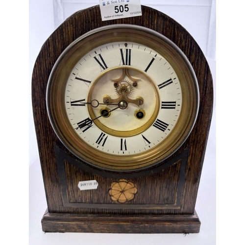 505 - Clocks: Clocks: An inlaid oak cased domed chiming mantel clock, with enamel chapter ring and visible... 