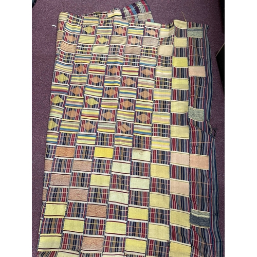 532 - Tribal: Tribal: An early 20th century Ashanti Kente cloth, Ghana, 156cm by 143cm.... 