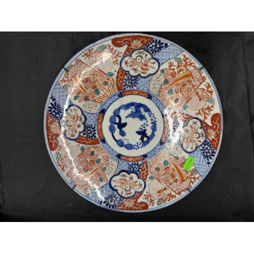 547 - Oriental: Oriental: A Japanese hexagonal Imari charger, painted in traditional colours with flowers ... 