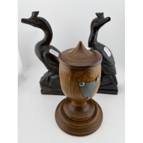 554 - Decorative Arts: Decorative Arts:: A pair of stylised Rosewood carved cranes signed W. Lang, 22cm hi... 