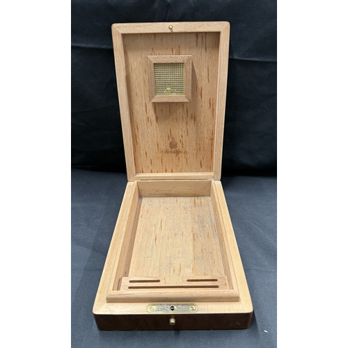 555 - Smoking Requisites: Smoking Requisites: Burr walnut Claridges humidor, 16cm x 24cm.