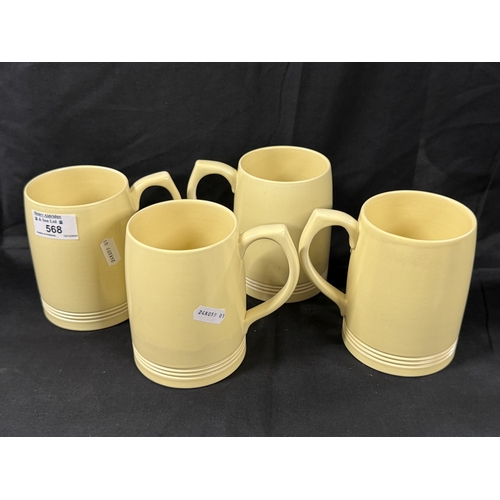 568 - Ceramics: Ceramics: A set of four yellow glazed Wedgwood tankards by Keith Murray, each with ribbing... 