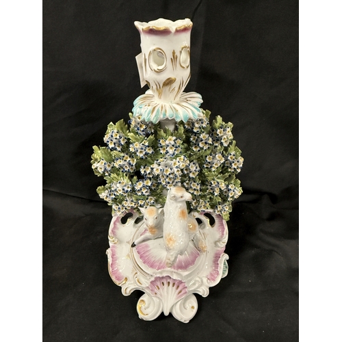 589 - Ceramics Ceramics: Derby chamberstick with bocage, - two lambs on a scrolled rococo base. Thumbed ha... 