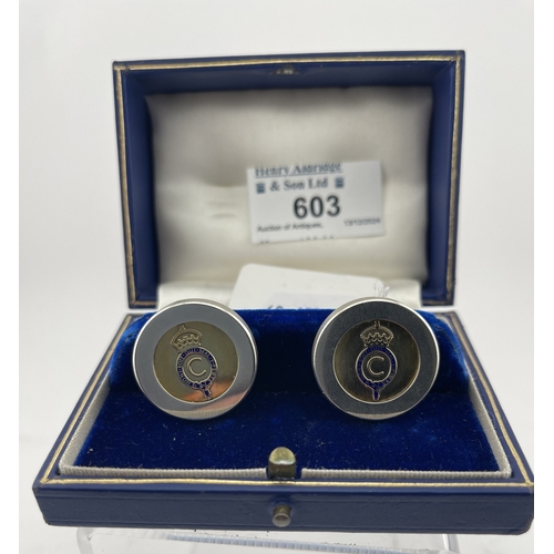 603 - Royal Interest: Royal Interest: A pair of silver cufflinks, hallmarked Birmingham 1969, with gilded ... 