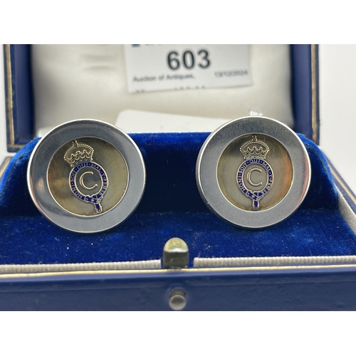 603 - Royal Interest: Royal Interest: A pair of silver cufflinks, hallmarked Birmingham 1969, with gilded ... 