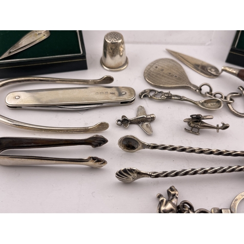 619 - Hallmarked Silver: Hallmarked Silver: A pair of wishbone sugar tongs, a set of anvil tongs, a treen ... 