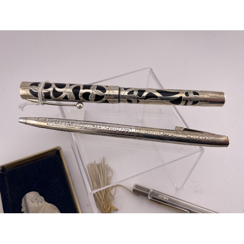 621 - Desktop Items: Desktop Items: A Sheaffer silver clad fountain pen with 18ct gold nib, a silver prope... 