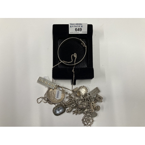 649 - Jewellery: Jewellery: A silver charm bracelet, a hinged silver bangle, an 800 grade necklace, a silv... 