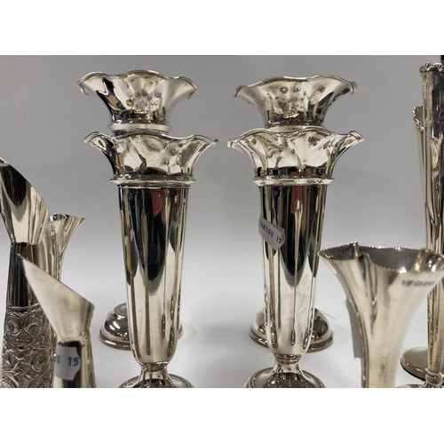 657 - Hallmarked Silver: Hallmarked Silver: A pair of trumpet vases, London 1928, with loaded bases, 22cm;... 