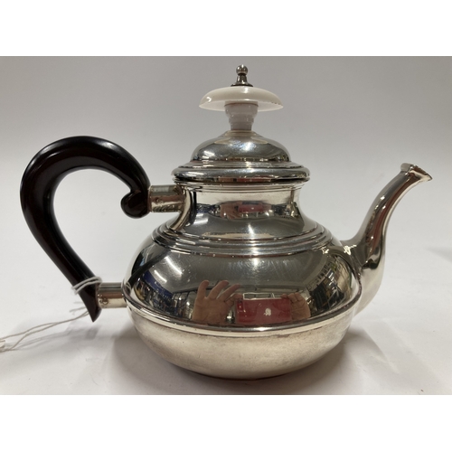 660 - Hallmarked Silver: Hallmarked Silver: A bachelors teapot, London 1921, with ebonised handle and repl... 